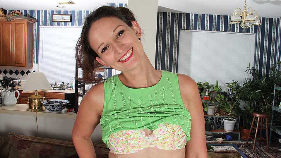 Naughty American housewife playing with her shaved pussy