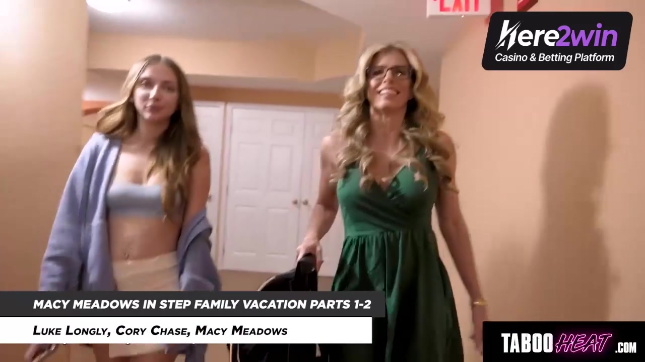 Smiling platinum-blonde honey with glasses in green dress